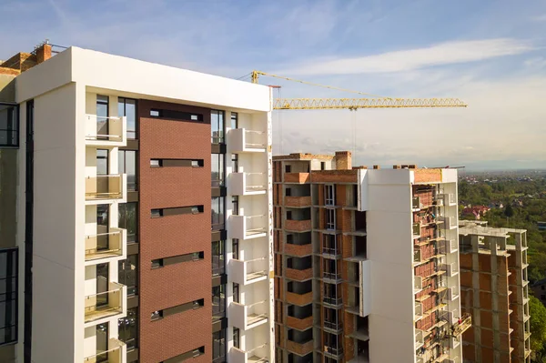 Aerial view of multi storey residential apartment buildings under construction. Real estate development.