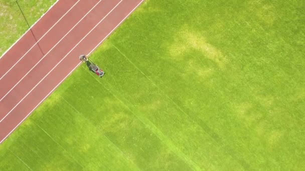 Aerial View Small Figure Worker Cutting Green Grass Mowing Mashine — Stock Video