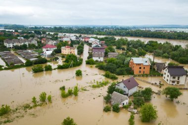 Aerial view of flooded houses with dirty water of Dnister river in Halych town, western Ukraine. clipart