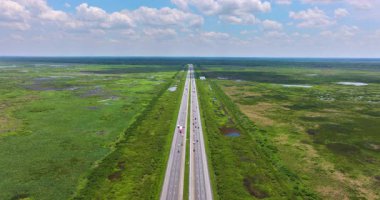 I-75 running through undeveloped Florida landscape with wetland vegetation