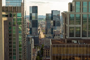 Drone shot of Nashville, Tennessee with urban layout, high buildings and city blocks below