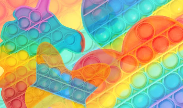 Flerfärgad regnbåge touch leksak pop det bakgrund Royaltyfria Stockbilder