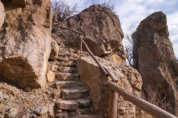 Hiking path through red rocks in Crimea