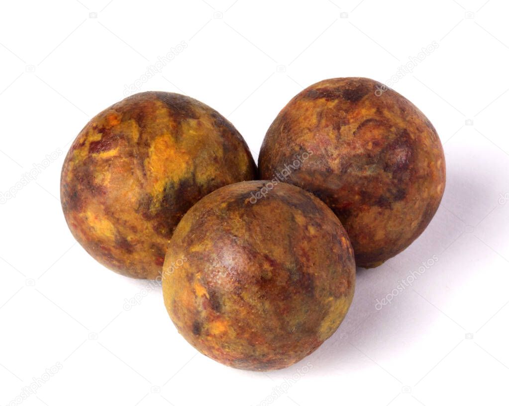 Propolis balls are isolated on a white background. Bee glue. Apitherapy. Beekeeping product
