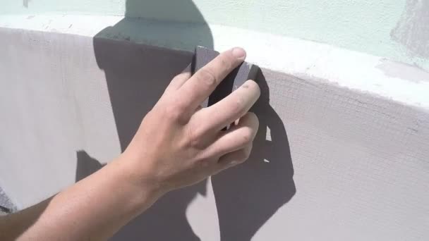 Worker Sanded After plastering the wall slow motion — Stock Video