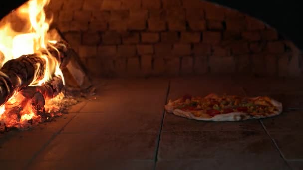 Pizza in wooden oven — Stock Video