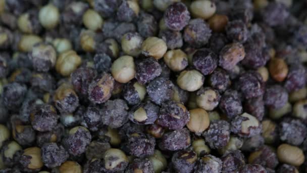 Fresh salty hazelnuts in market — Stock Video