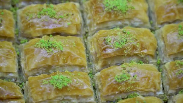 Turkish ramadan dessert Baklava with fiachio — стокове відео