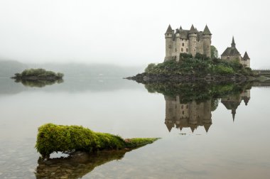 Chateau de Val in a foggy morning clipart