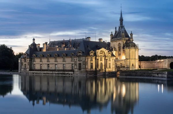 Castle of Chantilly at dusk — Stock Photo, Image