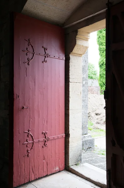 Opened red wooden door — Stock Photo, Image