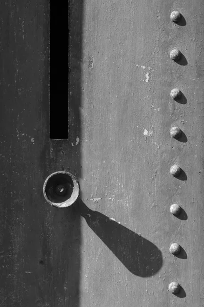 Doorknob on old gray door — Stock Photo, Image