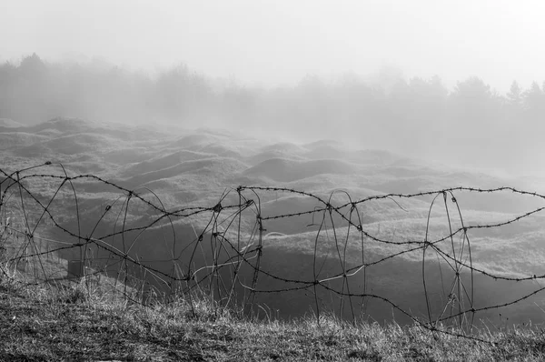 Barbed wire on the cliff — Stock Photo, Image