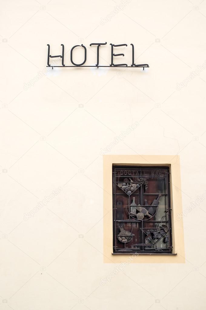 Little window with Hotel sign