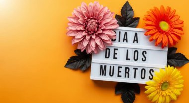 A vibrant Dia de los Muertos decoration featuring flowers on an orange background. This top-view image captures the essence of the Mexican Day of the Dead tradition.