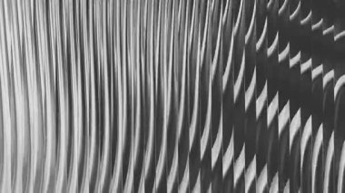 Tek renkli bir arka plan dalgalı çizgiler ve gölgeler içerir, derinlik ve doku yaratır. Modern tasarımlar, web siteleri ve sanatsal projeler için mükemmel, zarafet ekleyerek.