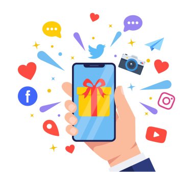 Çeşitli sosyal medya ve uygulama bildirimleriyle çevrili, ekranda hediye kutusu olan bir akıllı telefonu tutan bir iş adamının resmi.