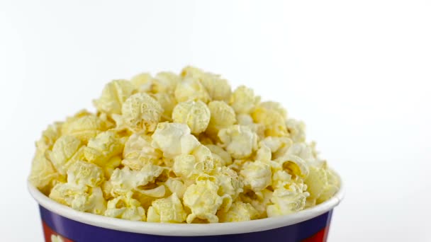 Salt popcorn in box on white background, rotation, close up — Stock Video