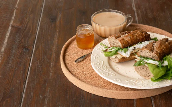 Breakfast sandwiches with coffee on a plate — Stock Photo, Image