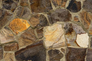 Koyu renkli taş dokusunun yakın çekimi. Koyu renklerde soyut, yaratıcı arkaplan.