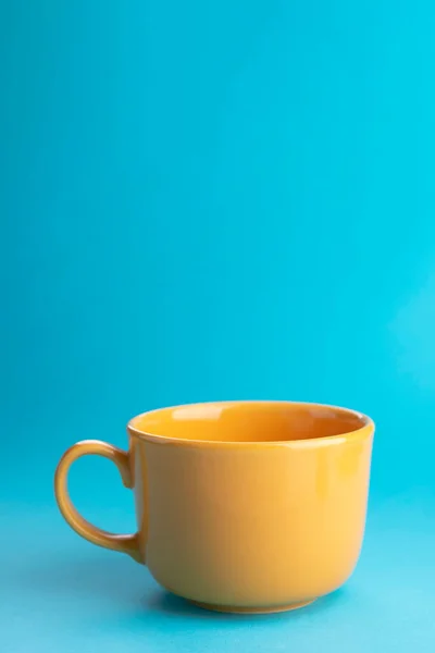 Yellow Empty Cup Tea Coffee Blue Background Place Your Text — Stock Photo, Image