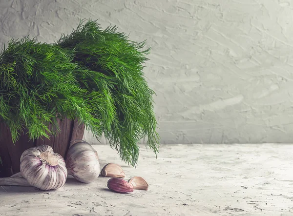 concept of healthy and natural food. Spices and herbs in a rustic setting. Dill and garlic for cooking. Ingredients for sauce appetizer tzatziki. vintage wooden food background