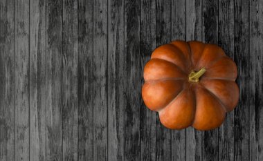 Masanın üstünde turuncu balkabağı var. Sonbahar arkaplanı. Sağlıklı gıda konsepti. Kabak kabağı maketi. Üst Manzara. Düz yatıyordu. Koyu arkaplan.