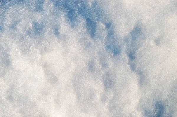 Fresh clean white snow background texture. Winter background with frozen snowflakes and snow mounds. Snow lumps. Seasonal landscape details. Cold weather. Sparkling snow. Freezing day.