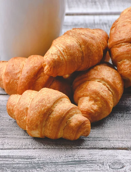 Homemade croissant served with black coffee or americano. Delicious breakfast with fresh croissant and coffee. Croissant and black coffee  with copy space. Croissant and coffee for coffee break.