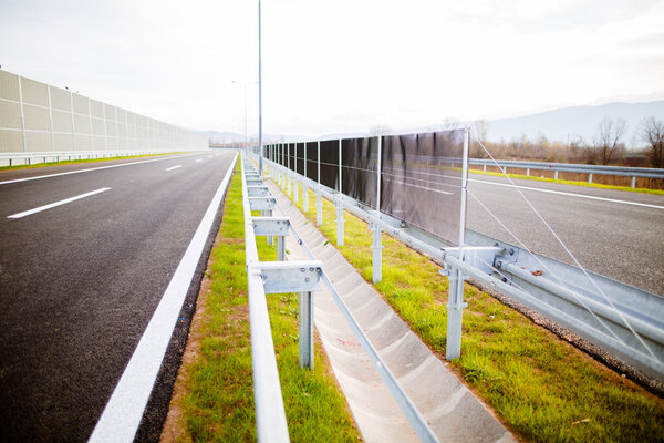 Asphalt highways road in rural scene use land transport and traveling concept.Vehicular traffic.Fence.Highway bumper