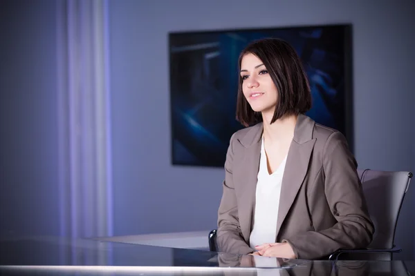 Young beautiful brunette television announcer at studio standing next to the camera.TV director at editor in studio — Stock Photo, Image