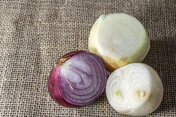 Red, yellow and white onions on white background in Brazil