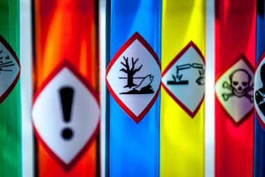Multicolored Chemistry vials - Focus on hazardous to the environment danger clipart