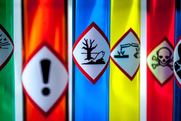 Multicolored Chemistry vials - Focus on hazardous to the environment danger — Stock Photo, Image