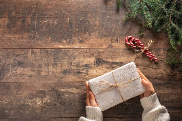 Christmas Gift Box Woman Hands White Sweater Wood Table Holding — Stock Photo, Image