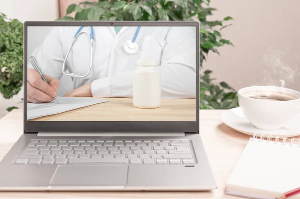 Doctor Writing Prescription on laptop screen. Online consultation, Virtual hospital and online therapy. Online consultation, Virtual hospital and online therapy.