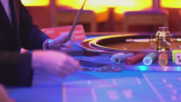 Roulette table in a casino - groupier at work — Stock Video