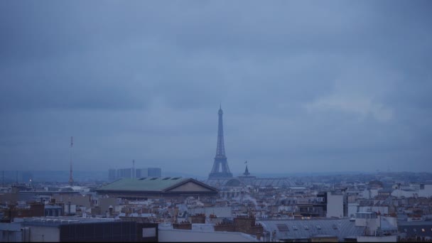 The Eiffel Tower in Paris in the evening view from a rooftop — Stock Video