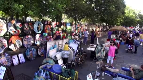 Sidewalk sale of art at Decatur Street New Orleans NEW ORLEANS, LOUISIANA USA — Stock Video