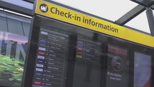 Check in information at London Heathrow Airport — Stock Video