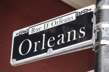 Street sign of Orleans Street at French Quarter clipart