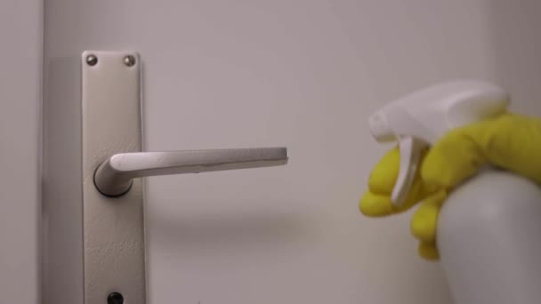 Woman disinfects a doorknob during Corona — Stock Video