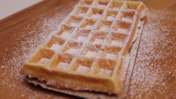Freshly baked Belgian waffle with sugar — Vídeos de Stock