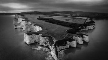 Old Harry Rocks in England - aerial view in black and white clipart