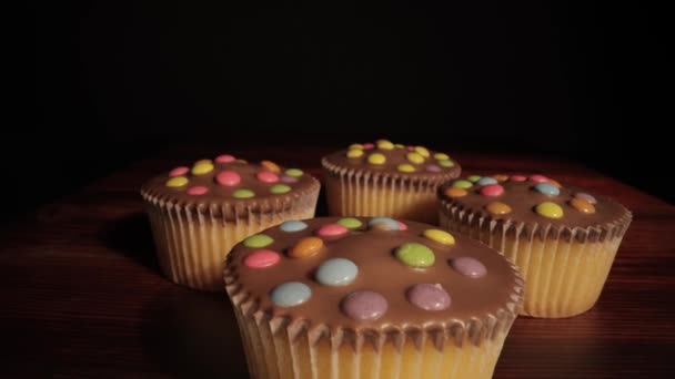 Delicious cupcakes on a table in close-up — Stock Video