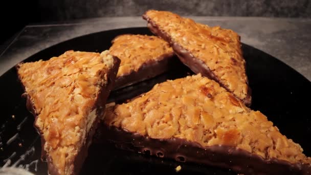 Sweet nut triangles with almonds - a German specialty — Stock Video