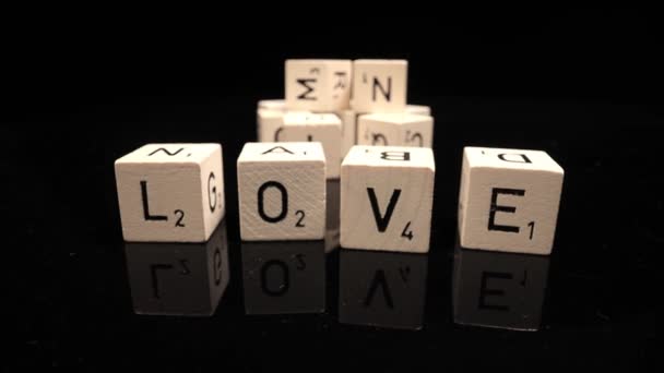 Letters on cubes write the word Love — Stock Video