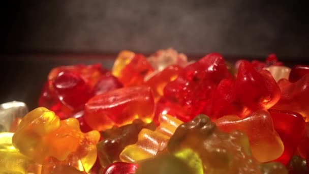 Macro view over colorful Gummy bears or jelly babies — Stock Video