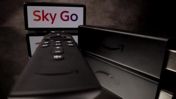 Sky Go Pay TV and Amazon Fire TV Stick 4k in close-up - CITY OF FRANKFURT, GERMANY - MARCH 29, 2021 — Stock Video