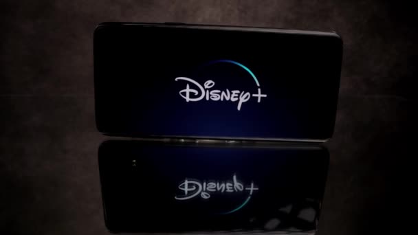 Disney Plus Streaming - Flight over TV Remote control - CITY OF FRANKFURT, GERMANY - 29 марта 2021 года — стоковое видео